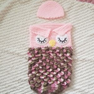 Newborn knitted owl onesie.